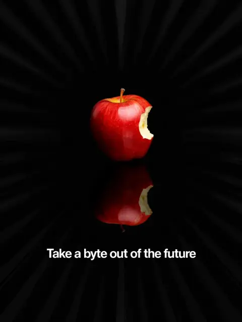 A 1977 Apple Computer magazine spread featuring a single red apple with a single bite taken out of it, set against a black background with a subtle radial gradient.  The tagline "Take a byte out of the future" is written in white Helvetica font, positioned below the apple. The image evokes a sense of mystery, intrigue, and the cutting edge of technology.